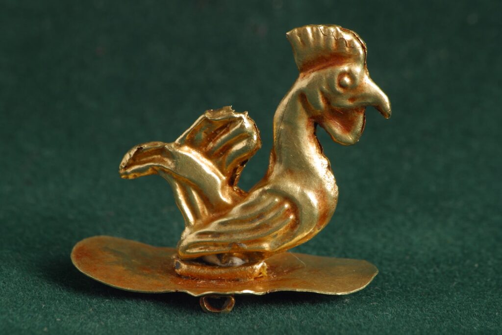 ancient figurine of a rooster
